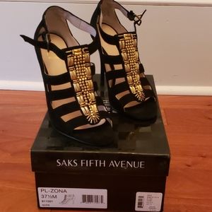 Black suede heels with gold